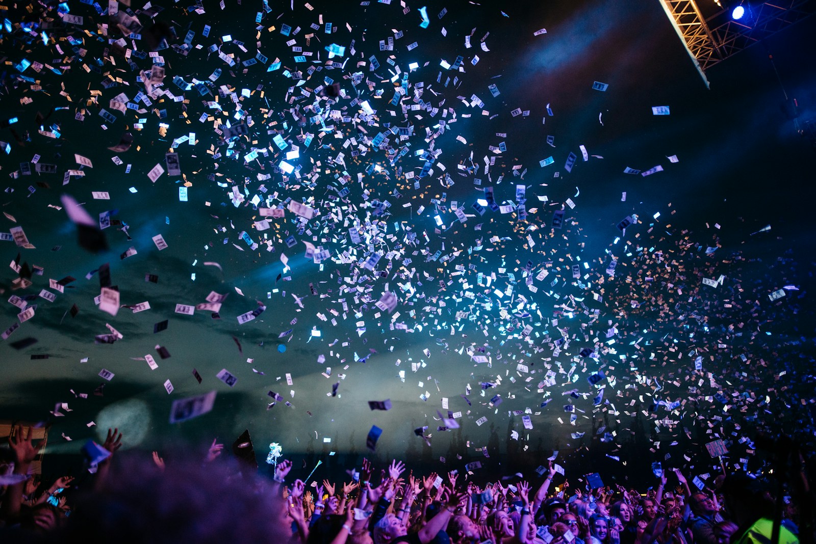 Confetti falling over an arena crowd