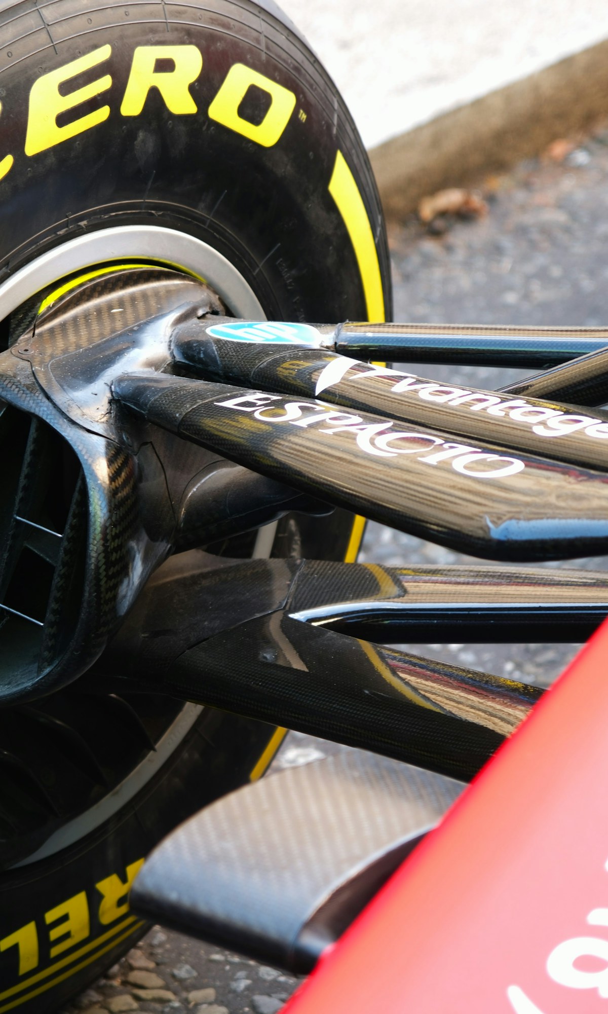 A racing tyre and suspension in dramatic close-up
