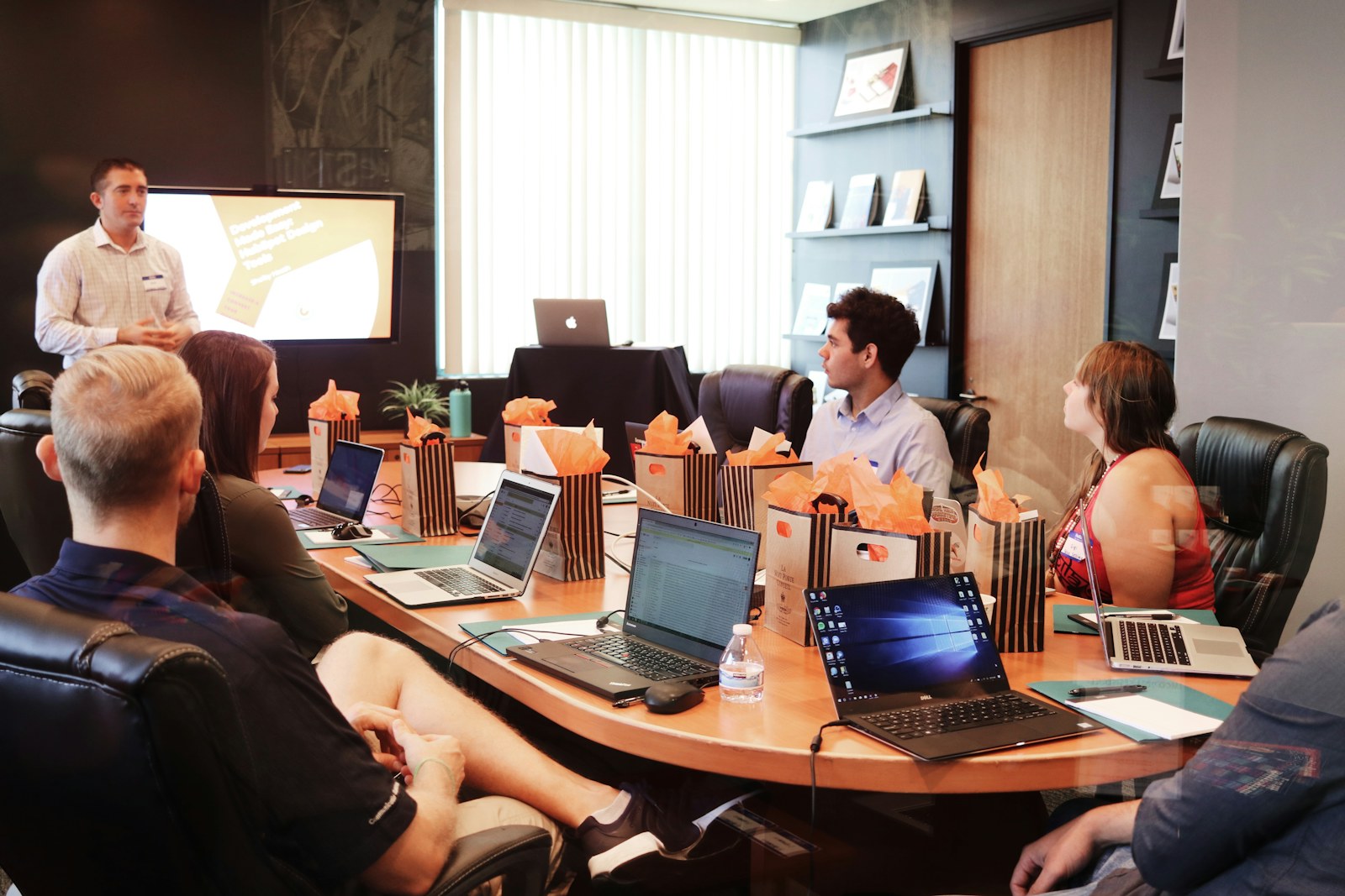 A presentation to partners around a boardroom table