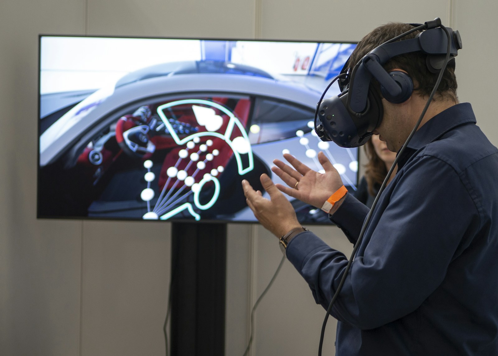 A person using a virtual reality racing simulator