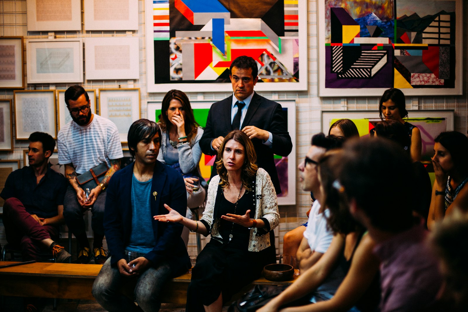 People gathered in conversation around a shared idea